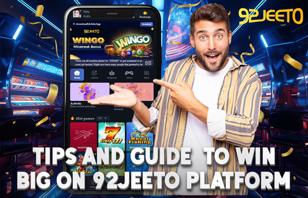 A picture of a man showing on his phone how to earn money on the 92Jeeto platform.